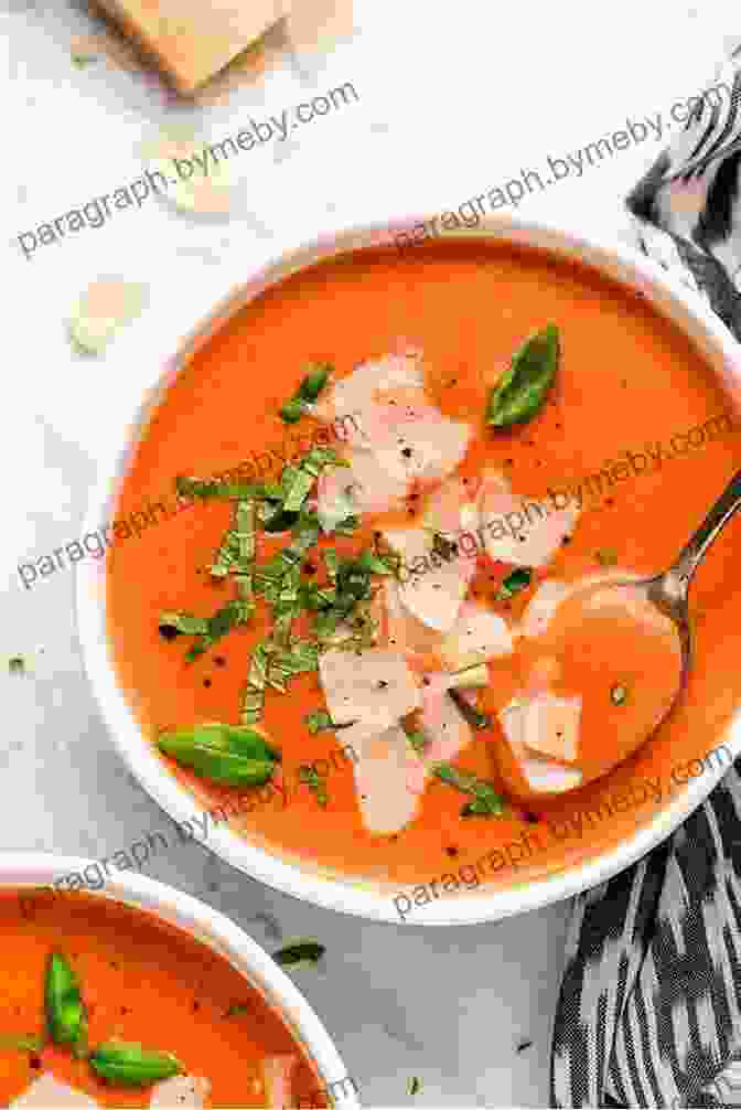 A Steaming Bowl Of Creamy Tomato Soup Garnished With Fresh Basil How To Make Cake Pops Macarons: Over Than 100 Top Recipes Presented In One Cookbook