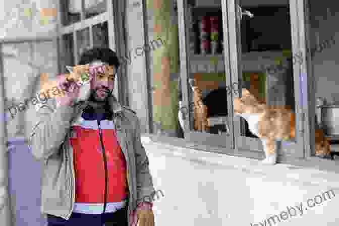 The Cat Man Of Aleppo, Mohammad Alaa Aljaleel, Holding A Cat In His Arms The Cat Man Of Aleppo